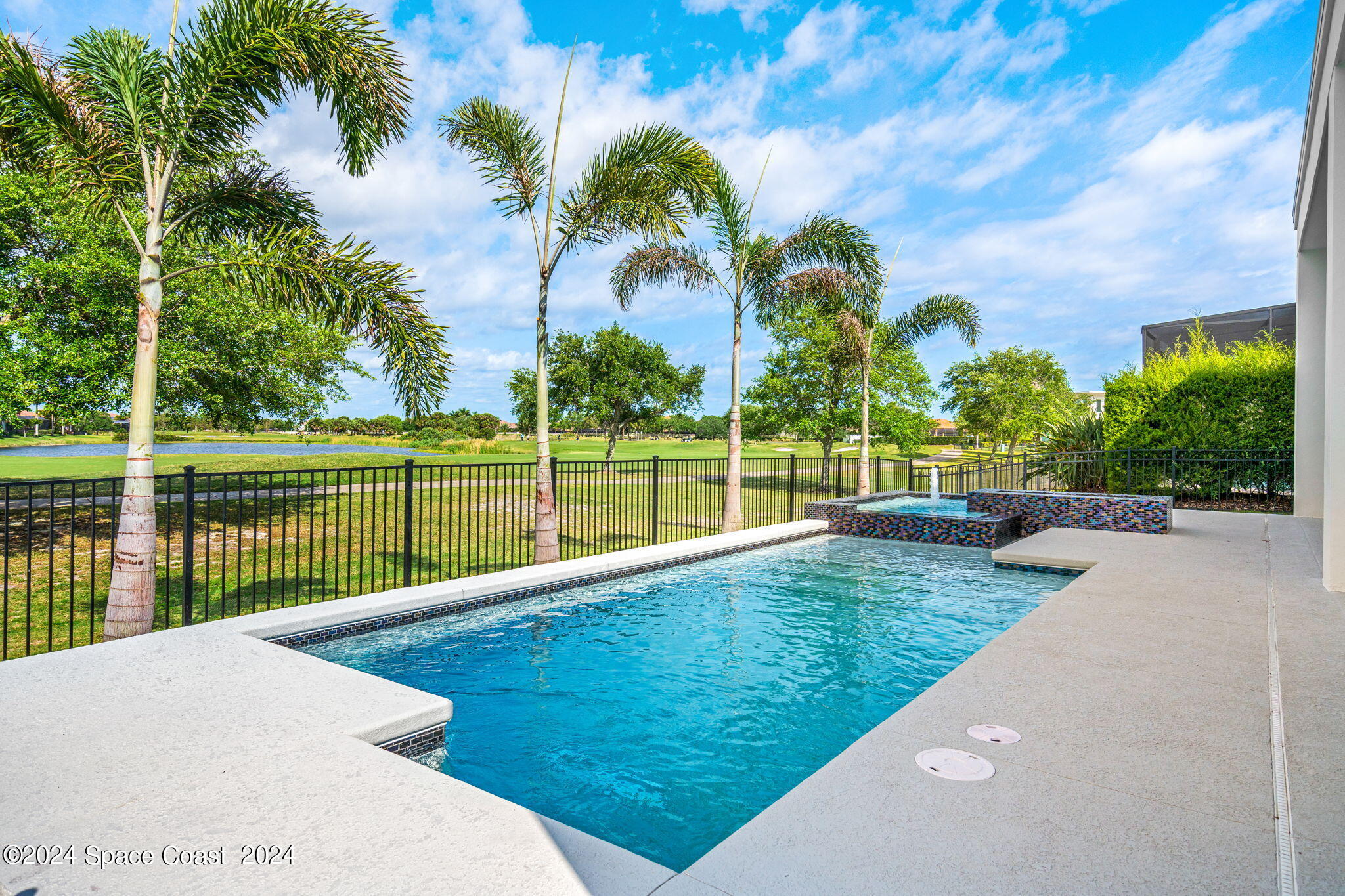 6374 Modern Duran Drive Melbourne, FL 32940 - Photo 37 of 55 a view of a garden and lake