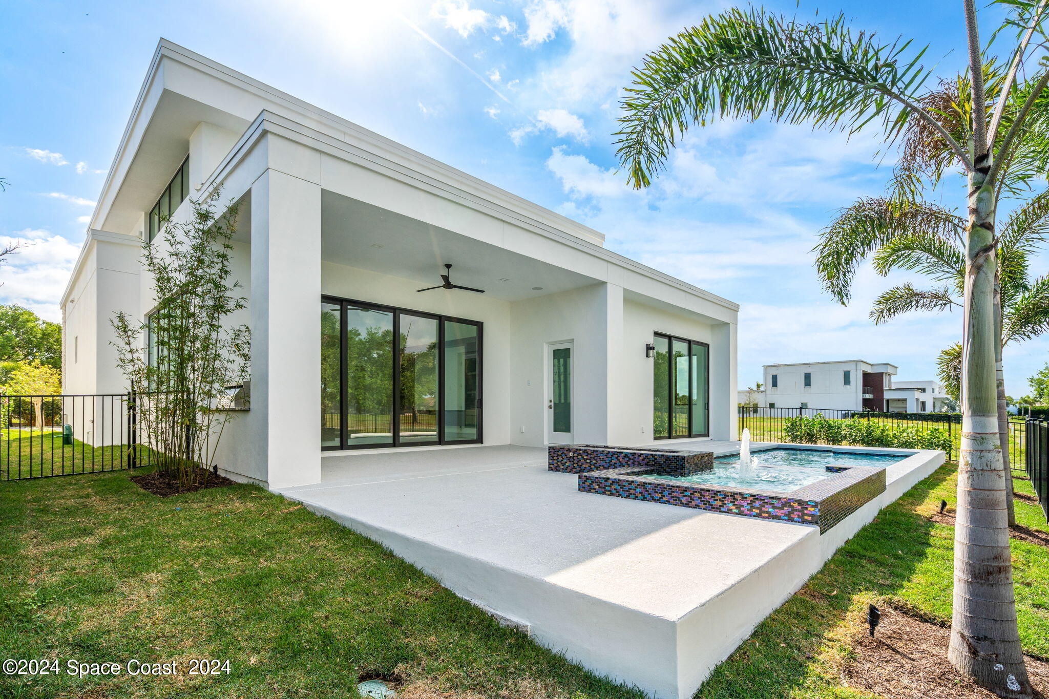 6374 Modern Duran Drive Melbourne, FL 32940 - Photo 39 of 55 a front view of a house with garden