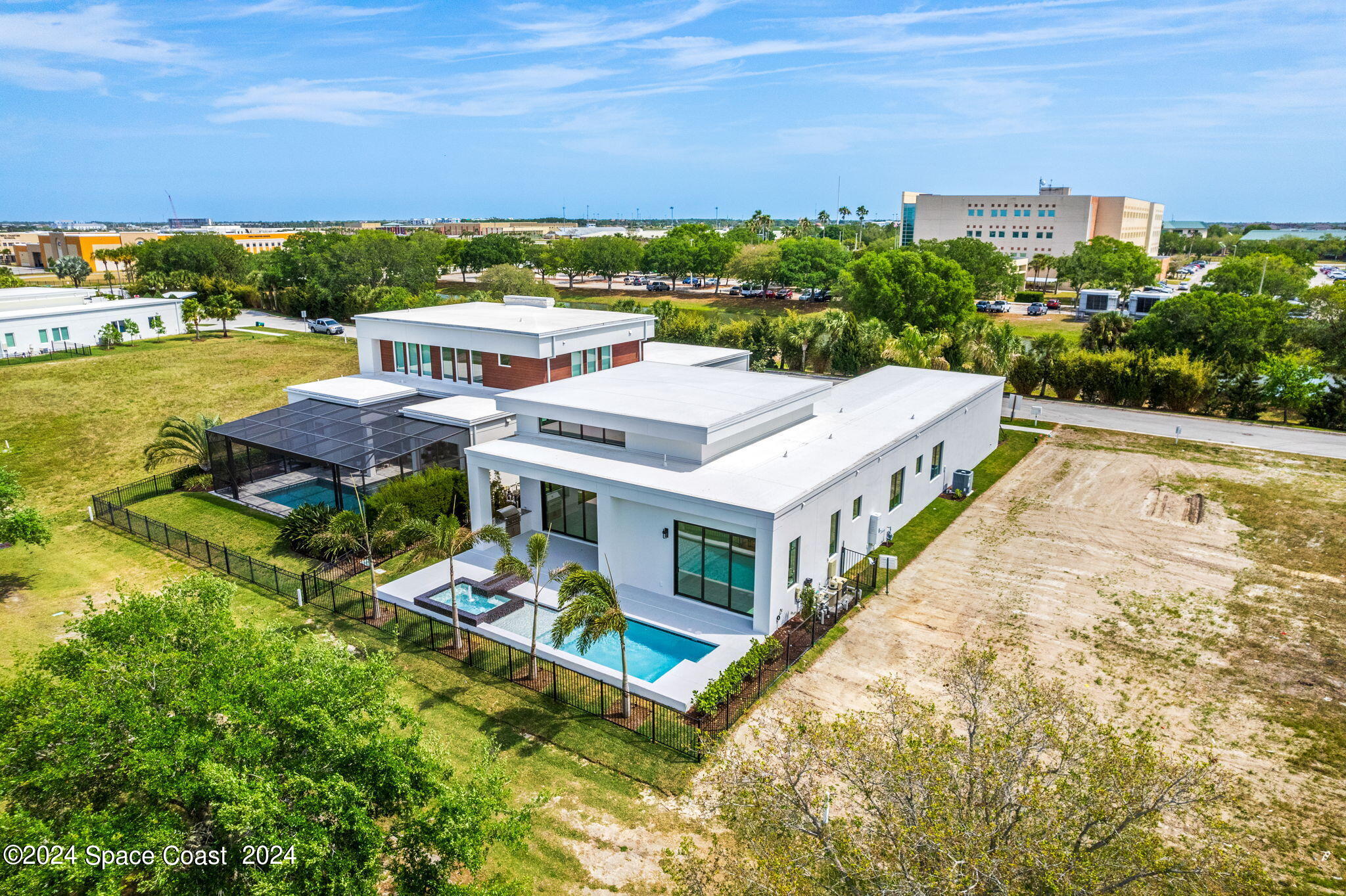 6374 Modern Duran Drive Melbourne, FL 32940 - Photo 52 of 55 an aerial view of residential houses with outdoor space and ocean view