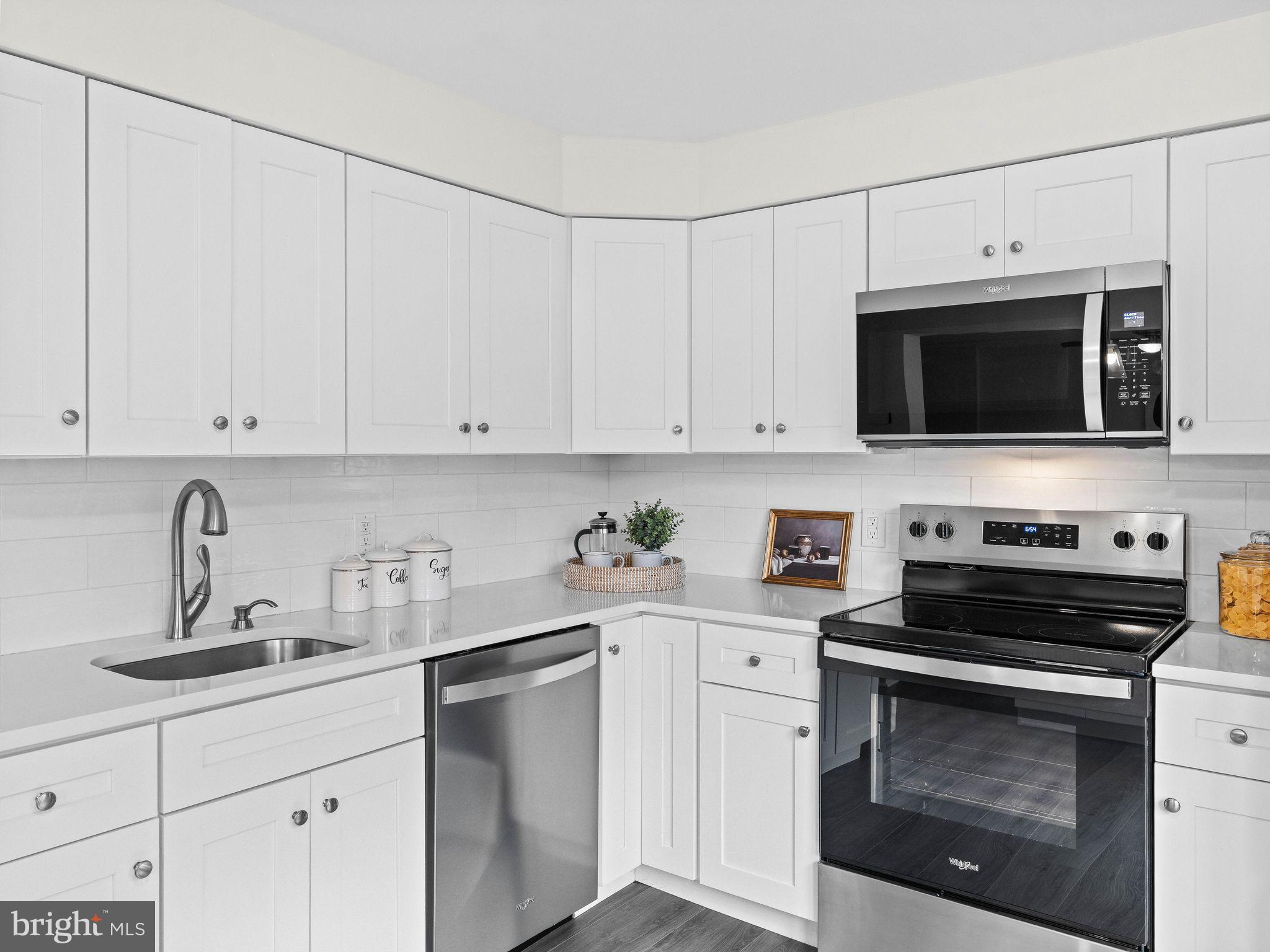 166 Pearl Croft Road Cherry Hill, NJ 08034 - Photo 9 of 34 Sleek white kitchen with modern finishes.
