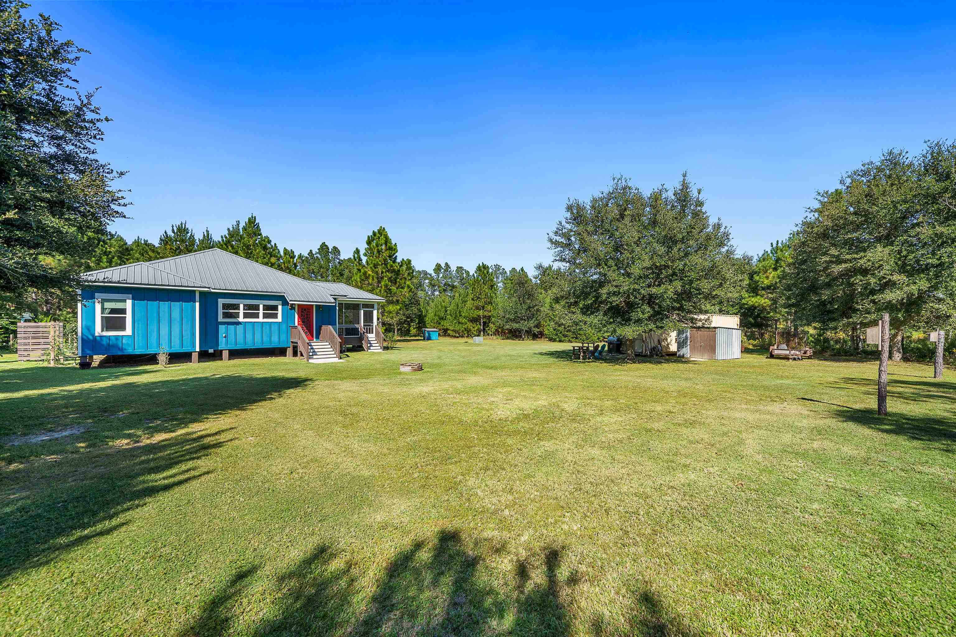 24616 Bretz Lane Elberta, AL 36530 - Photo 35 of 42 Spacious backyard view of home and storage container.