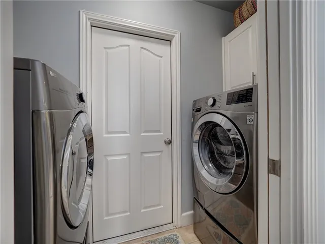 a view of a hallway with closet and workspace