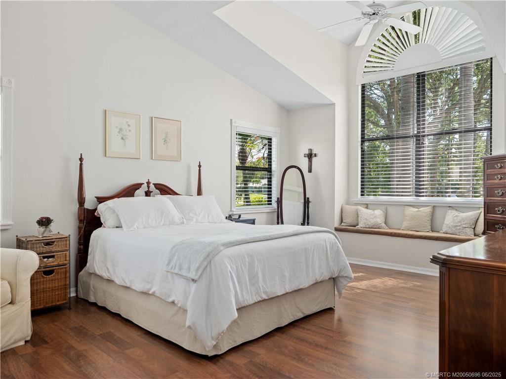 5692 Southeast Lamay Drive Stuart, FL 34997 - Photo 13 of 28 a bedroom with a large bed and a large window