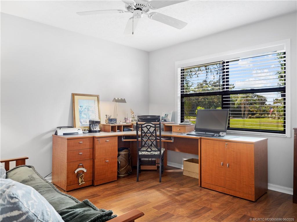 5692 Southeast Lamay Drive Stuart, FL 34997 - Photo 20 of 28 a view of a workspace with furniture and a window
