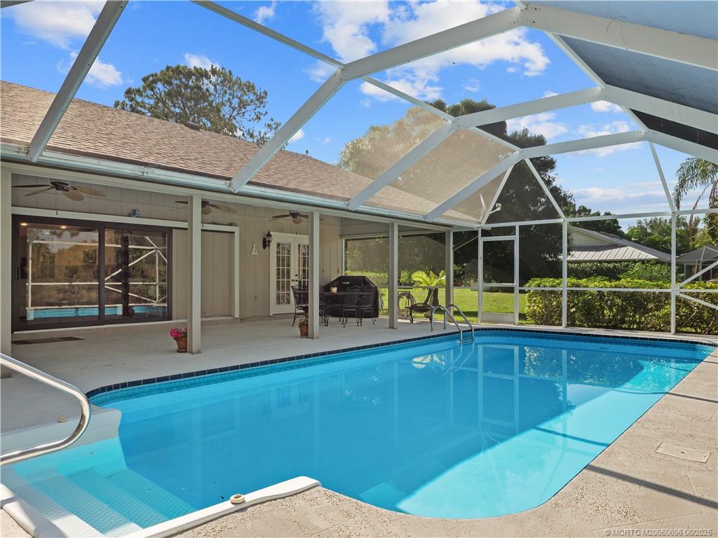 5692 Southeast Lamay Drive Stuart, FL 34997 - Photo 22 of 28 a view of a living room and a wooden floor