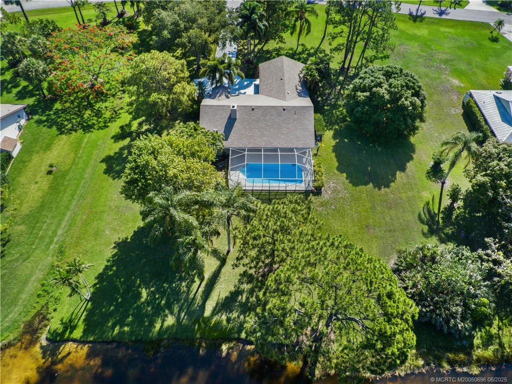 5692 Southeast Lamay Drive Stuart, FL 34997 - Photo 27 of 28 an aerial view of a house with a yard and lake view
