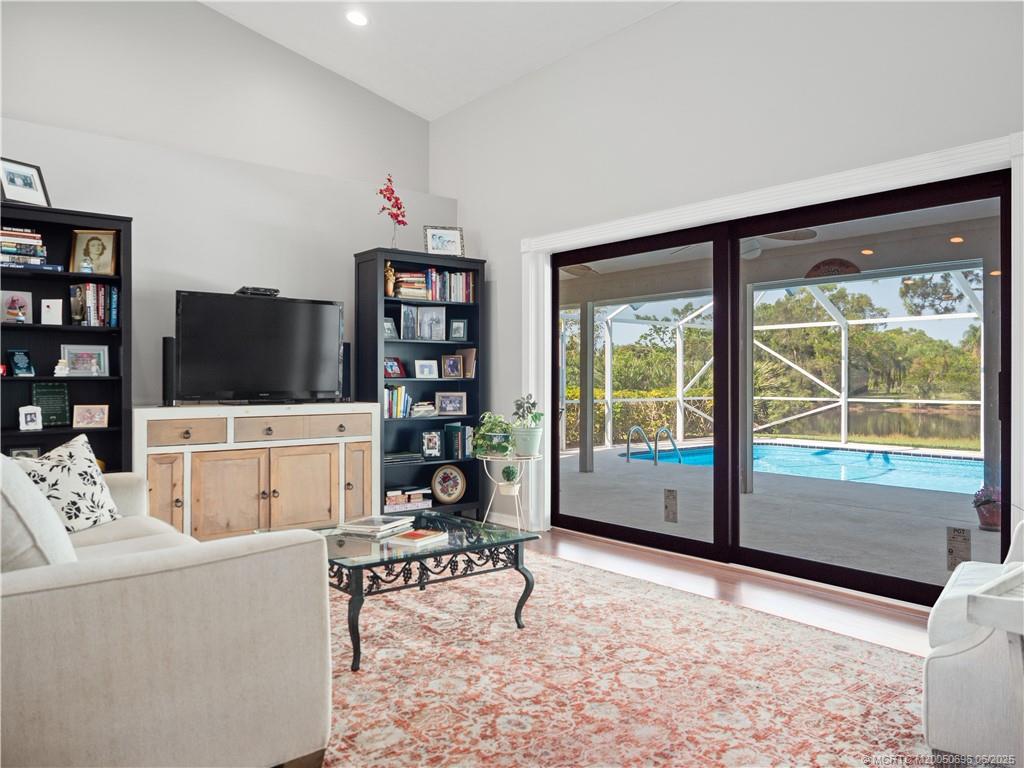 5692 Southeast Lamay Drive Stuart, FL 34997 - Photo 4 of 28 a living room with furniture and a flat screen tv
