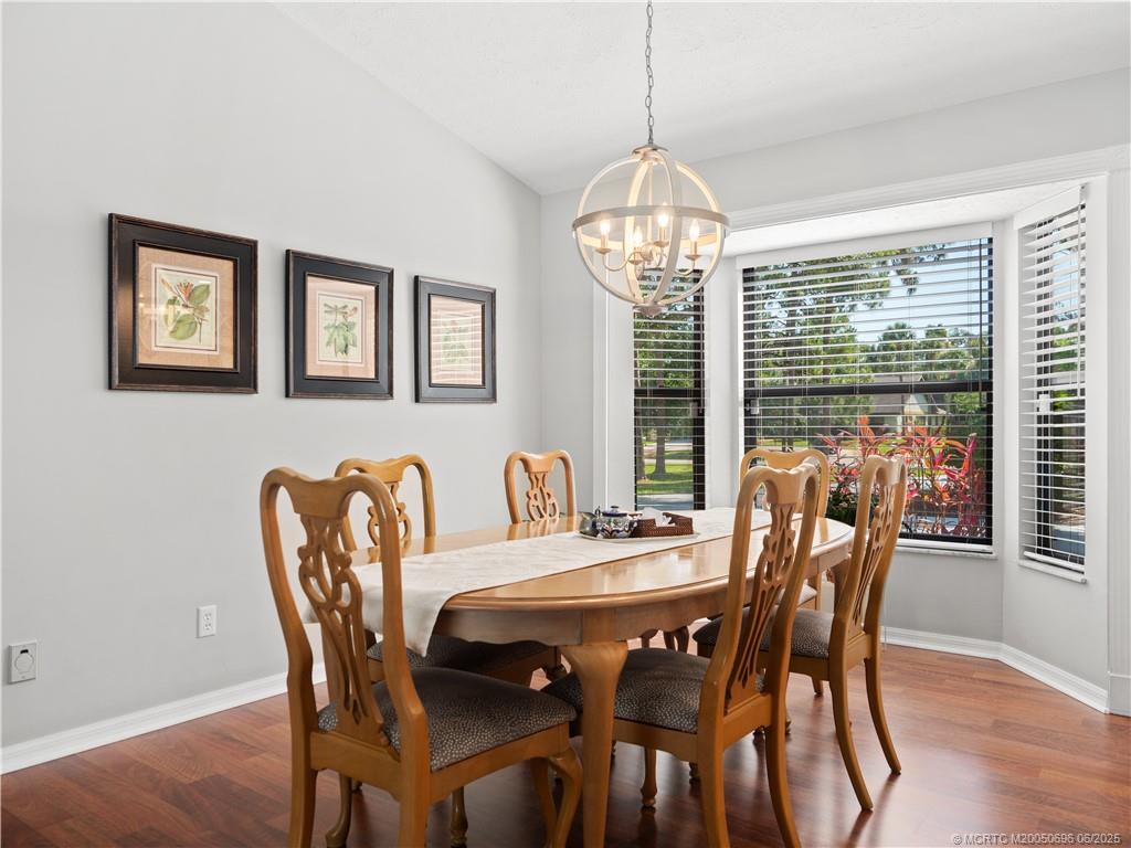 5692 Southeast Lamay Drive Stuart, FL 34997 - Photo 8 of 28 a view of a dining room with furniture window and wooden floor