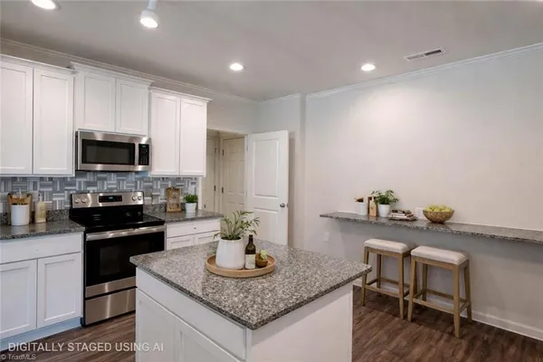 $325,000 | 6548 Donahue Drive, Whitsett, NC 27377