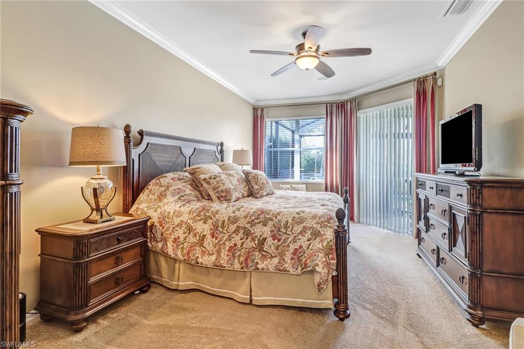 21156 Braxfield Loop Estero, FL 33928 - Photo 15 of 43 a bedroom with a bed and a flat screen tv