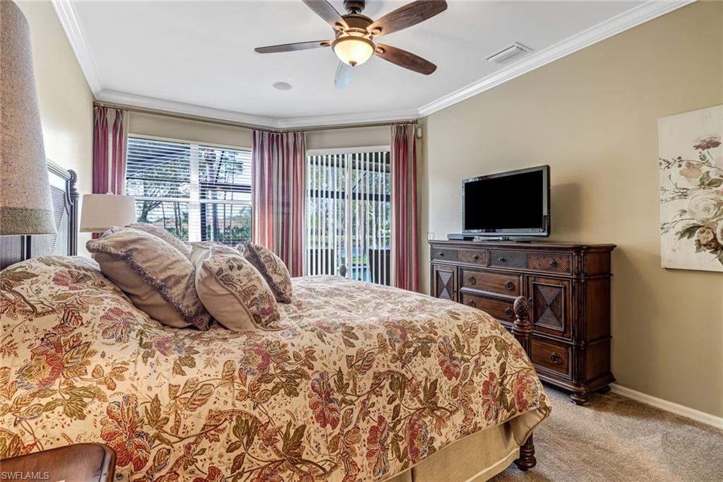 21156 Braxfield Loop Estero, FL 33928 - Photo 16 of 43 a bedroom with a bed and a flat screen tv