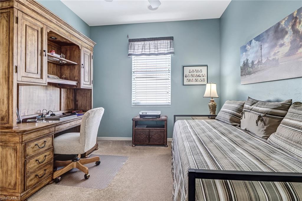 21156 Braxfield Loop Estero, FL 33928 - Photo 19 of 43 a bedroom with a bed and furniture