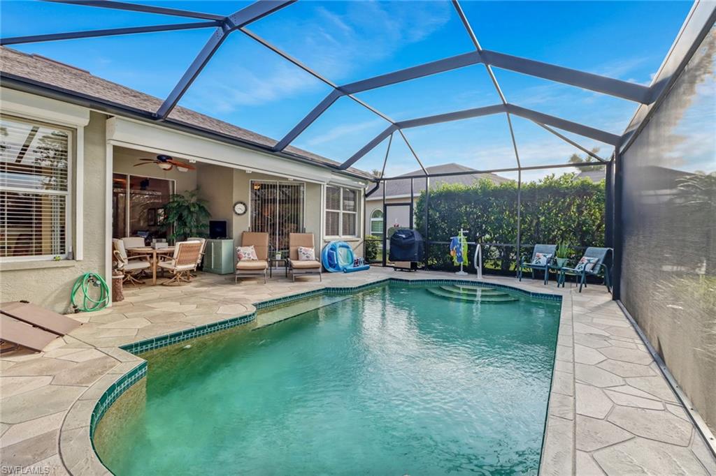 21156 Braxfield Loop Estero, FL 33928 - Photo 25 of 43 a view of a swimming pool with sitting area