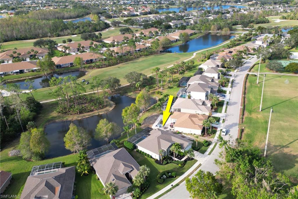 21156 Braxfield Loop Estero, FL 33928 - Photo 28 of 43 an aerial view of residential houses with outdoor space and lake view
