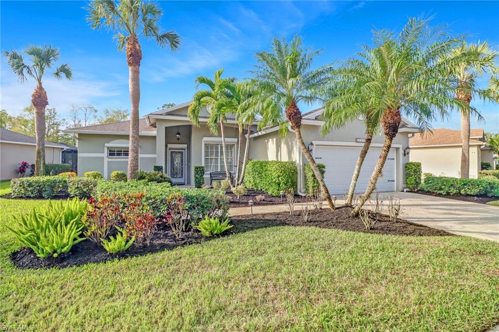 21156 Braxfield Loop Estero, FL 33928 - Photo 42 of 43 a front view of a house with a garden