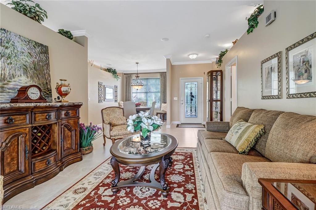 21156 Braxfield Loop Estero, FL 33928 - Photo 6 of 43 a living room with furniture and a fireplace