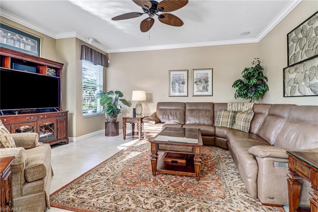 21156 Braxfield Loop Estero, FL 33928 - Photo 7 of 43 a living room with furniture and a flat screen tv