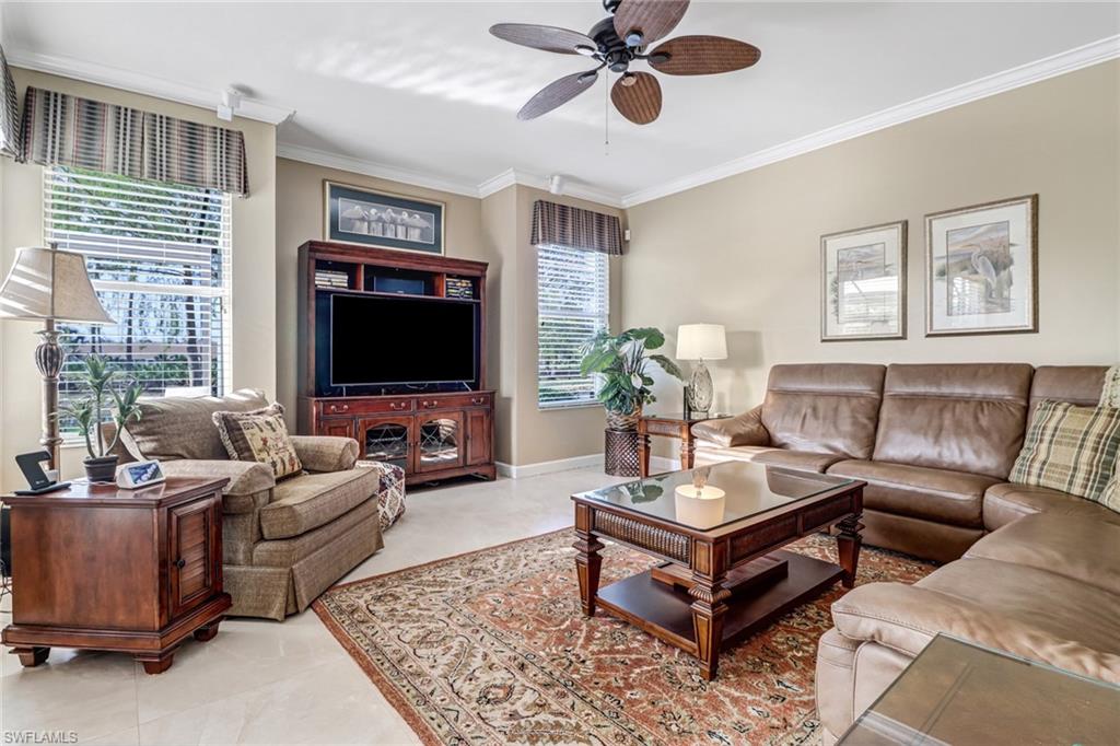 21156 Braxfield Loop Estero, FL 33928 - Photo 8 of 43 a living room with furniture and a flat screen tv