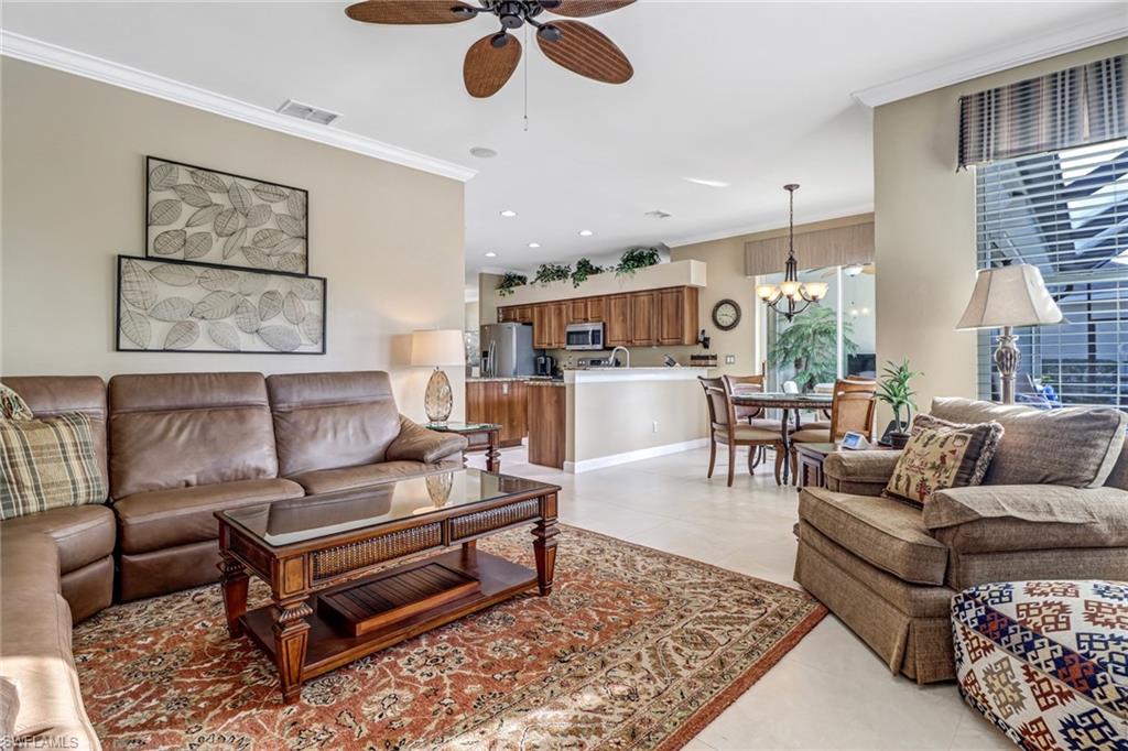 21156 Braxfield Loop Estero, FL 33928 - Photo 9 of 43 a living room with furniture kitchen view and a table