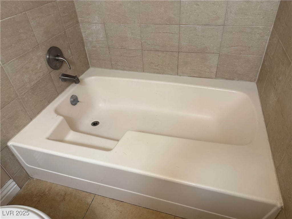 4689 West Sand Creek Avenue, Unit C Las Vegas, NV 89103 - Photo 13 of 14 Full bath with tile patterned floors
