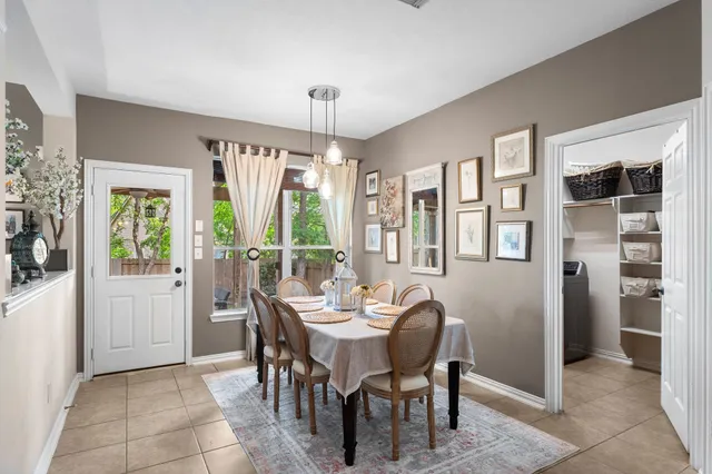 a view of a dining room with furniture window and outside view
