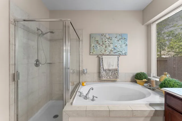 a bathroom with a tub and shower