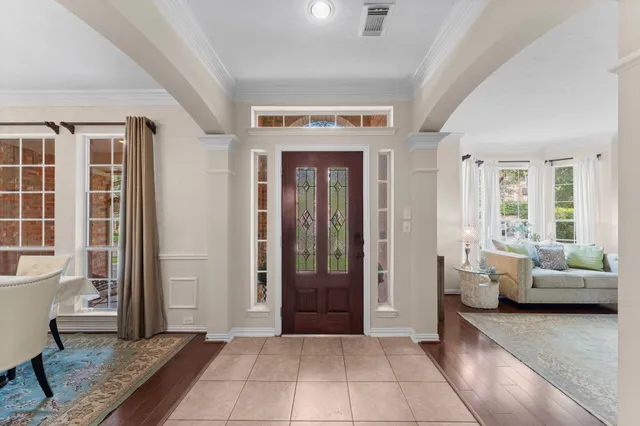 a living room with furniture and windows