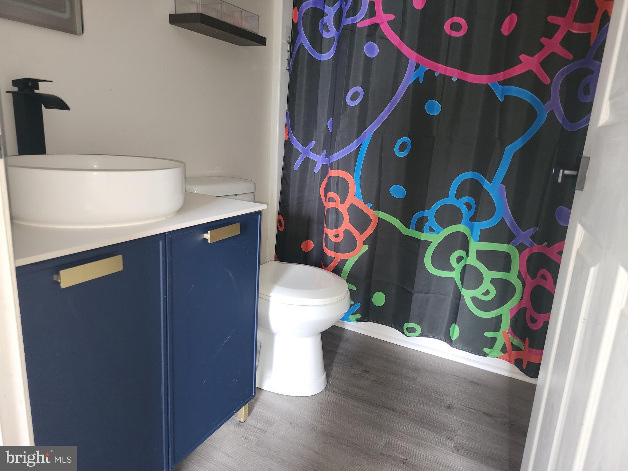 114 Spruance Road Dover, DE 19901 - Photo 12 of 12 a bathroom with a sink and toilet