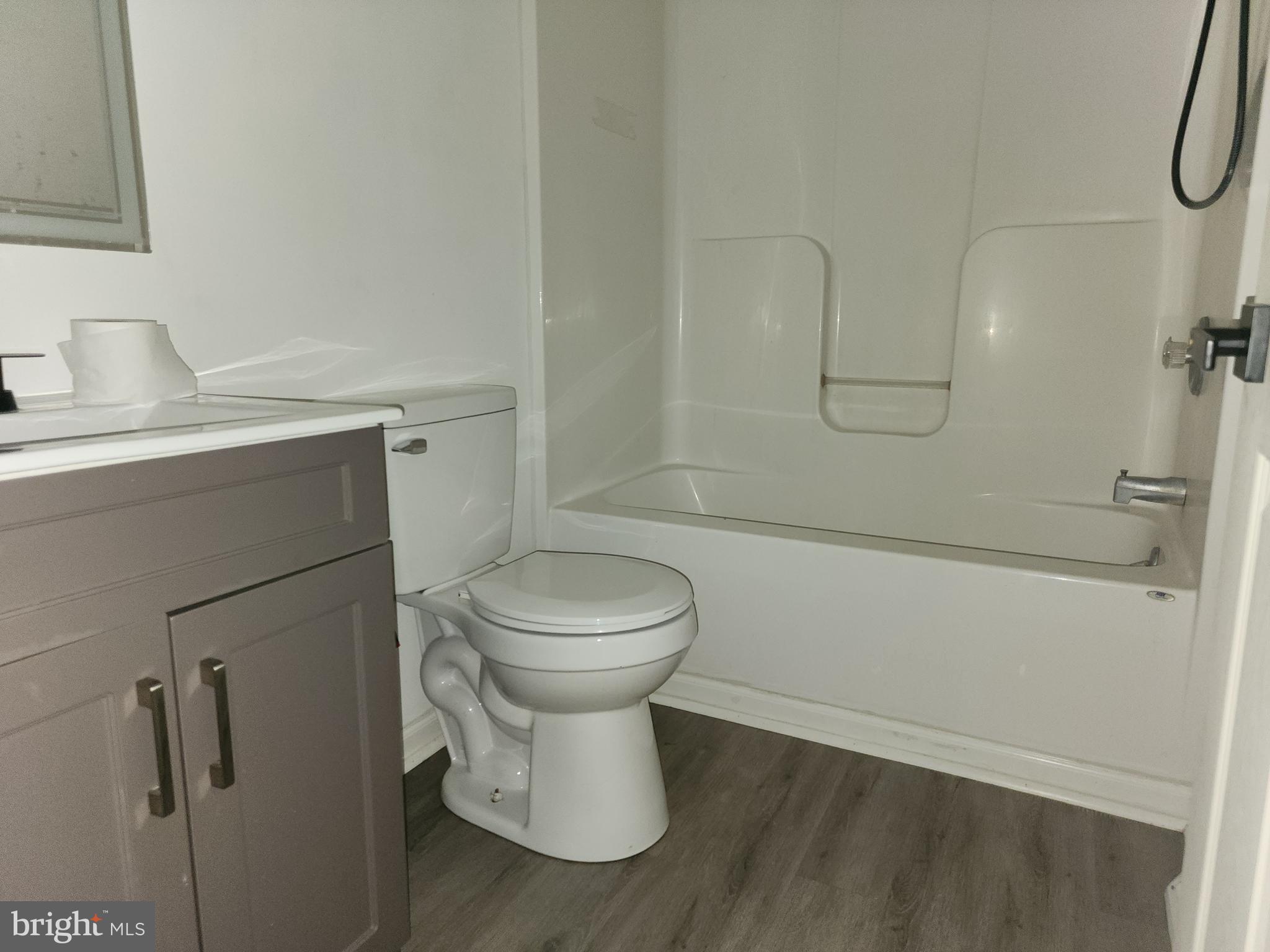 114 Spruance Road Dover, DE 19901 - Photo 10 of 12 a bathroom with a toilet sink and shower