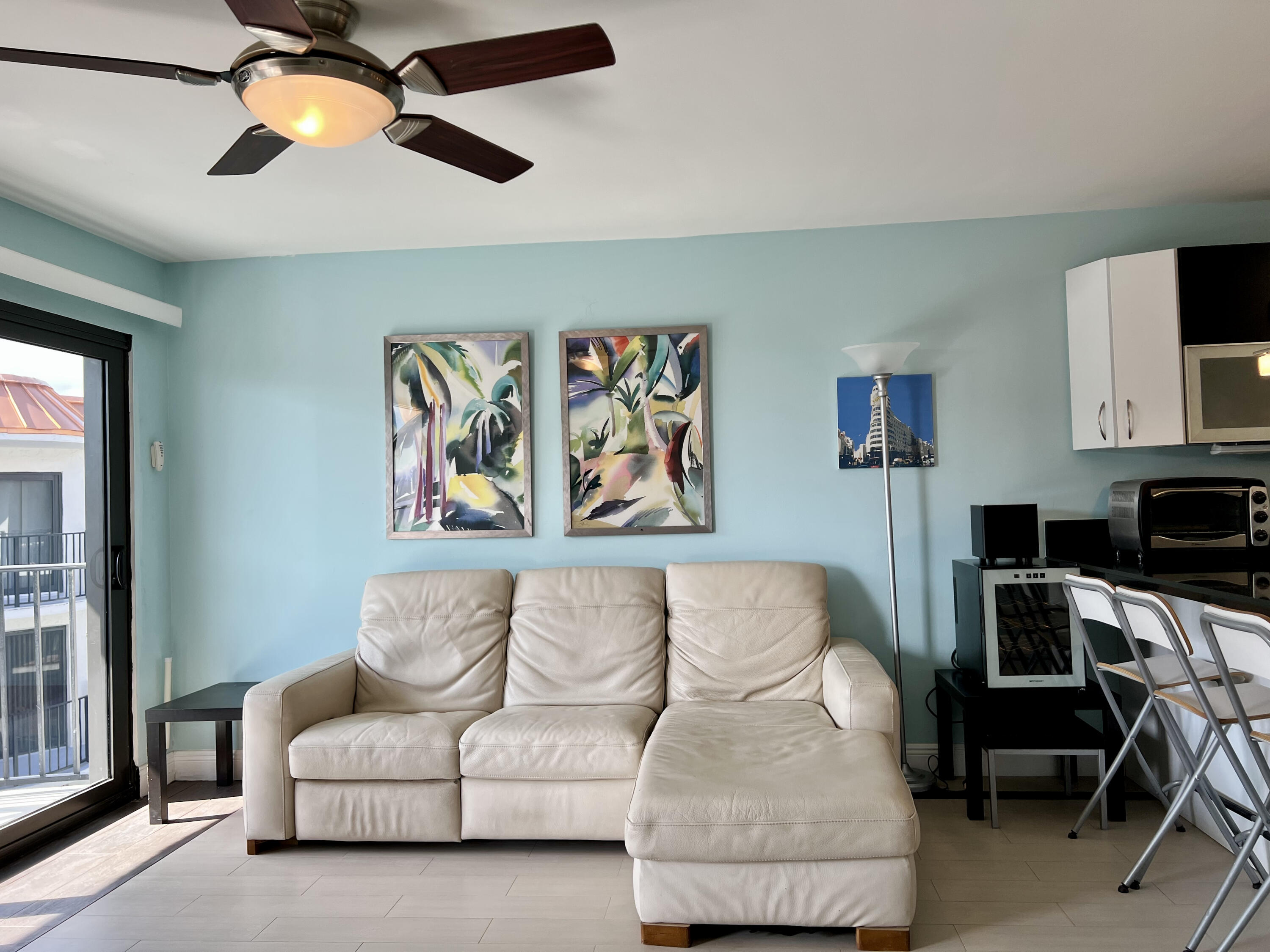 2029 North Ocean Boulevard, Unit 510 Fort Lauderdale, FL 33305 - Photo 13 of 39 a living room with furniture and a flat screen tv