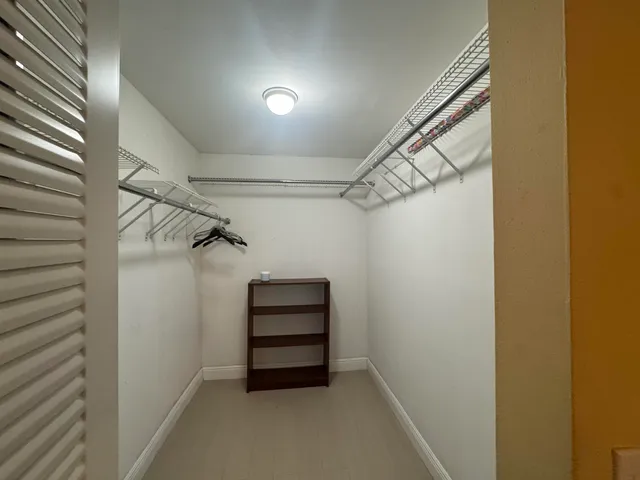 a view of room with racks on the wall