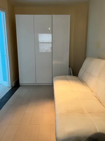 a bedroom with a bed and a cabinets