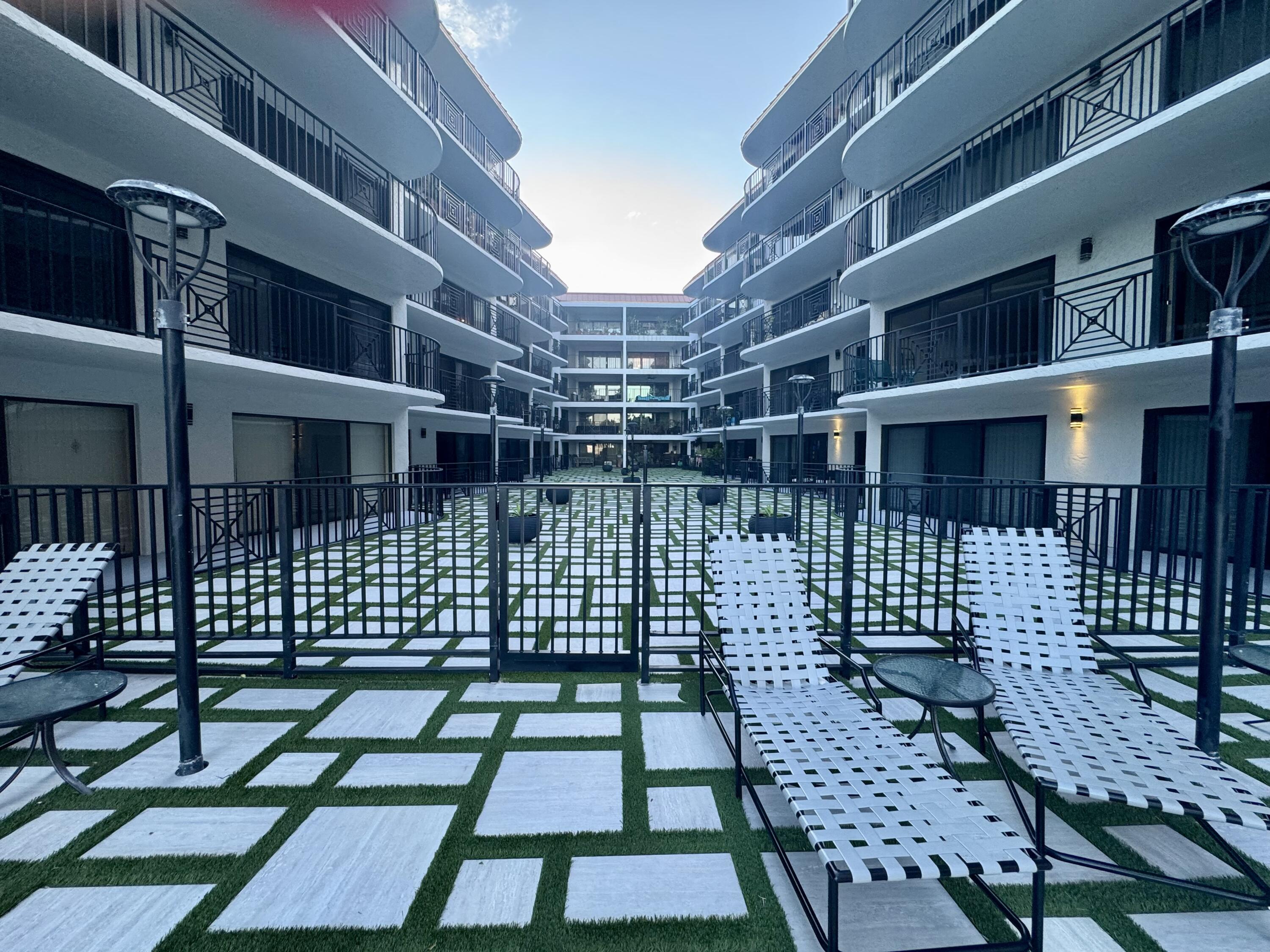 2029 North Ocean Boulevard, Unit 510 Fort Lauderdale, FL 33305 - Photo 29 of 39 a view of a porch with a bench