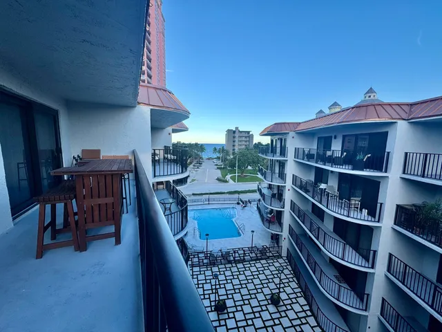 a view of a room with shelves and wooden floor