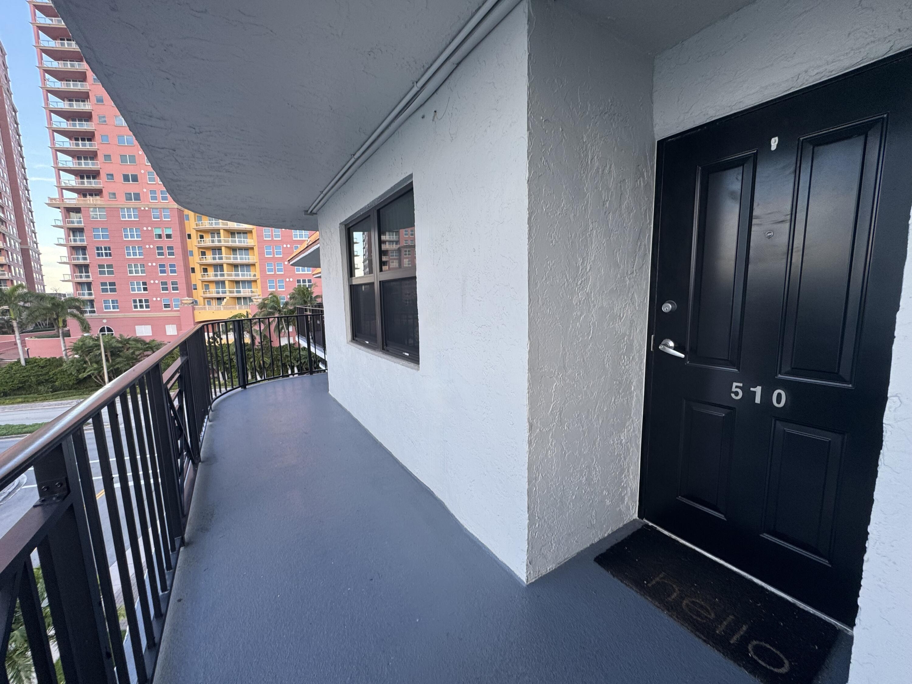 2029 North Ocean Boulevard, Unit 510 Fort Lauderdale, FL 33305 - Photo 4 of 39 wooden floor in an entryway with a window