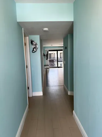 wooden floor in a hall with an entryway
