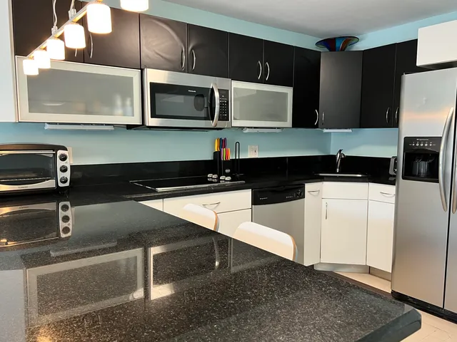 a kitchen with a sink and a microwave