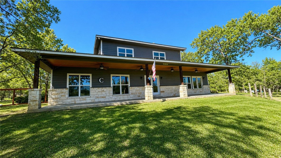 11810 Riley Green Road Franklin, TX 77856 - Photo 22 of 36 a view of a house with sitting area and garden