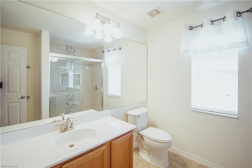 2133 Fairmont Lane Naples, FL 34120 - Photo 16 of 31 a bathroom with a sink toilet and shower