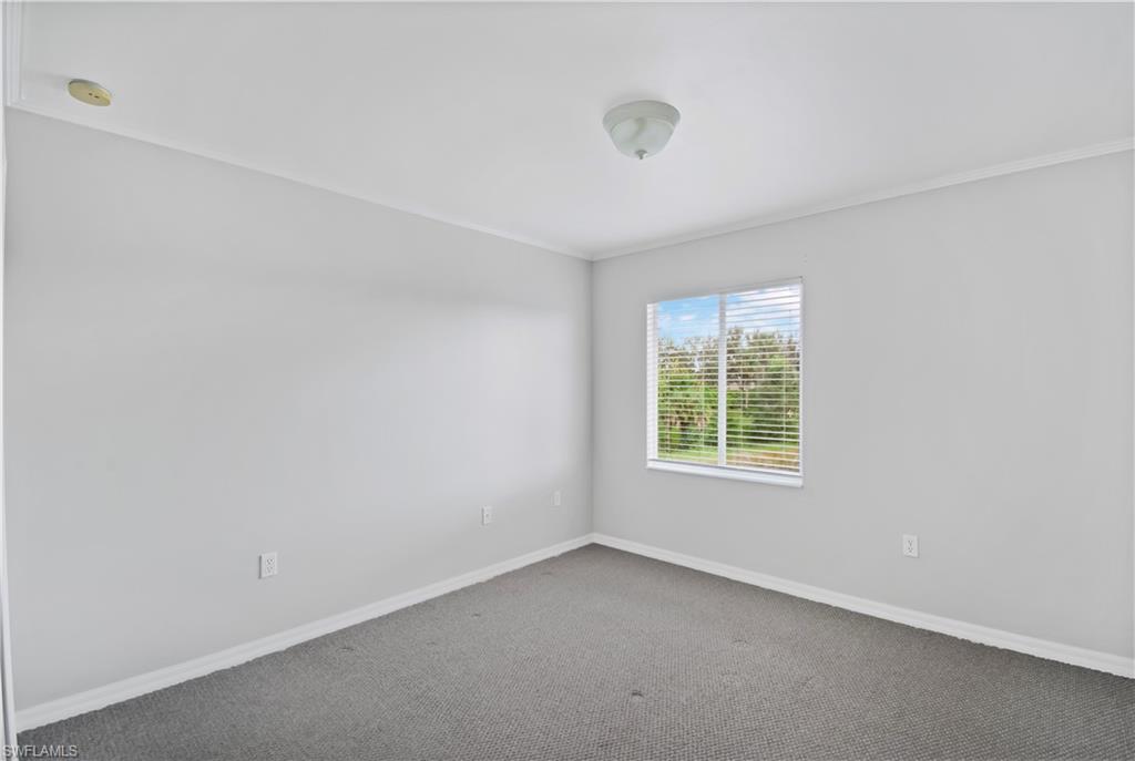 2133 Fairmont Lane Naples, FL 34120 - Photo 17 of 31 an empty room with a window