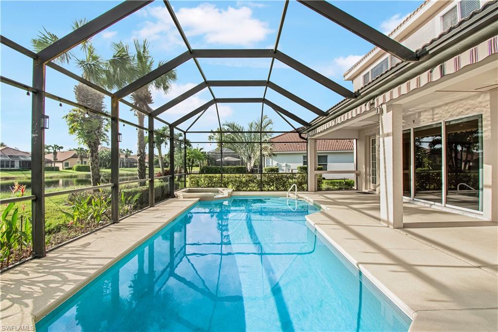 2133 Fairmont Lane Naples, FL 34120 - Photo 2 of 31 a view of a patio with a table and chairs