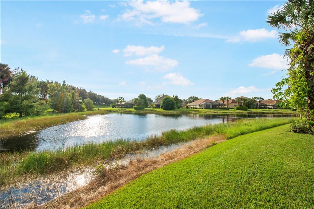2133 Fairmont Lane Naples, FL 34120 - Photo 21 of 31 a view of a lake with houses in the back