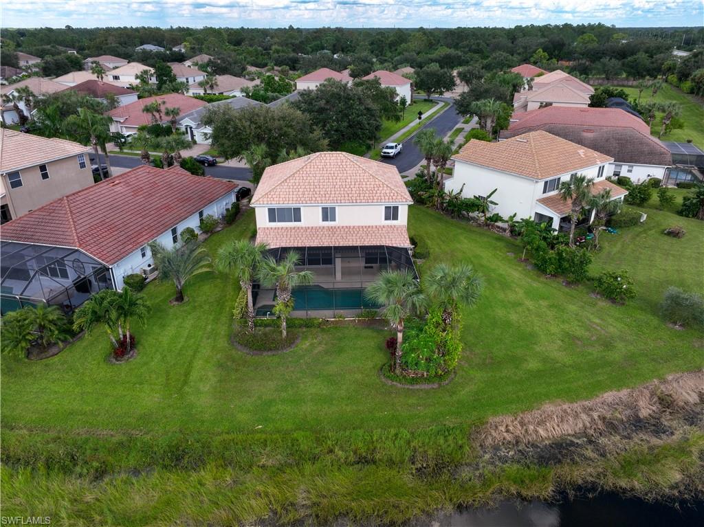 2133 Fairmont Lane Naples, FL 34120 - Photo 22 of 31 an aerial view of multiple houses with yard