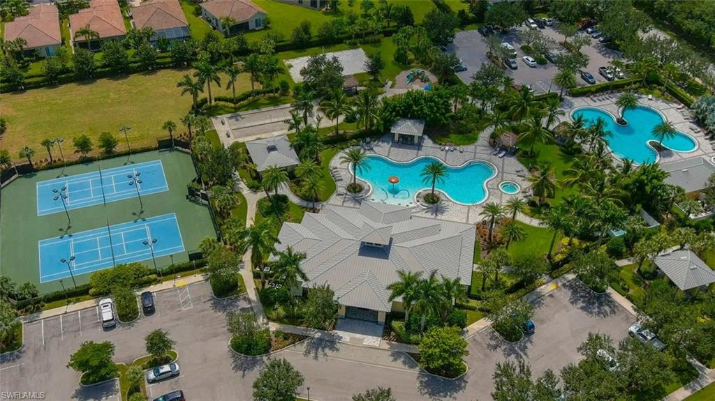 2133 Fairmont Lane Naples, FL 34120 - Photo 26 of 31 an aerial view of a house with a yard and lake view