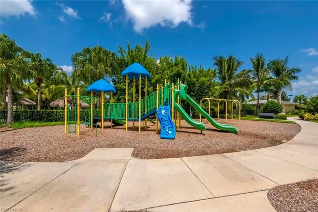 a view of a park with swings and slides