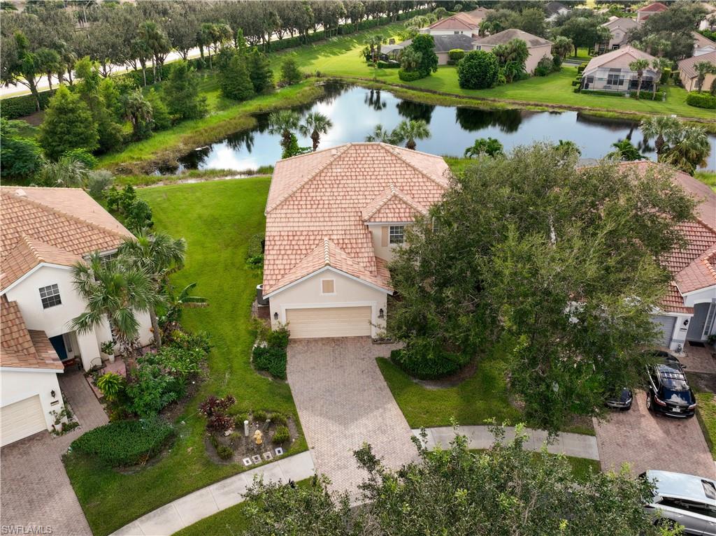 2133 Fairmont Lane Naples, FL 34120 - Photo 3 of 31 an aerial view of a house with outdoor space and lake view