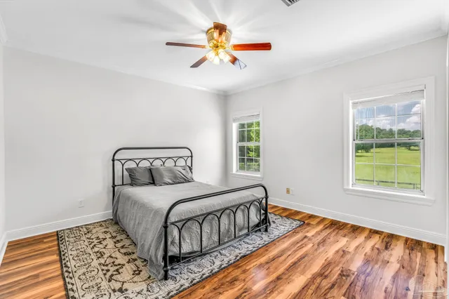 a bedroom with a large bed and a window
