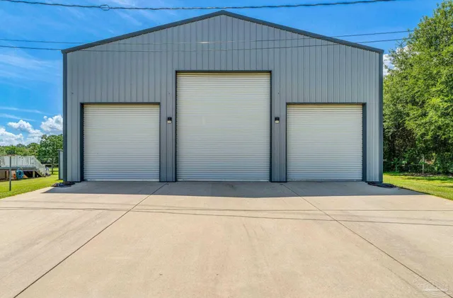 a view of a house with a yard balcony and slide