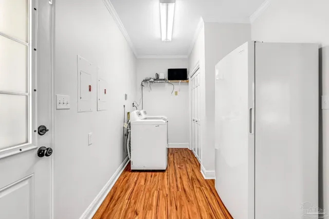 an aerial view of a house with garden space and street view