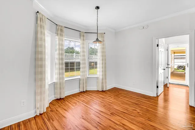 a bedroom with a bed and a table